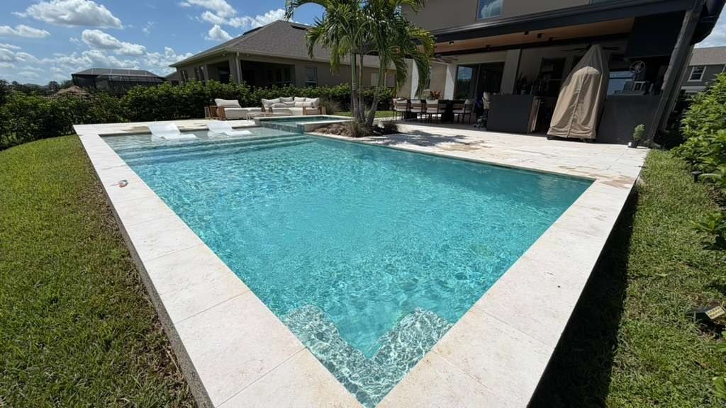 Backyard pool and spa maintained by RC Professional Cleaning