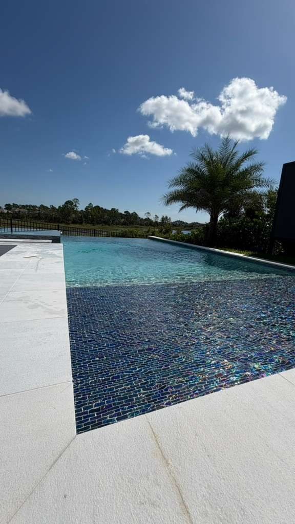 Infinity edge pool overlooking a lake
