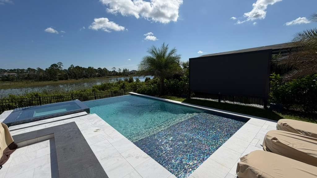 Infinity edge pool and spa with outdoor screen