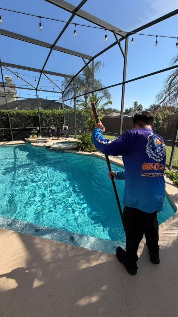 RC Professional Cleaning technician working poolside