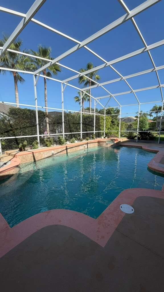 Freeform pool with screened lanai