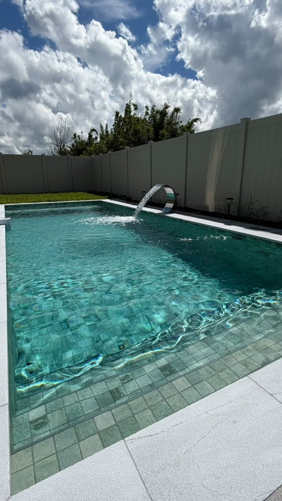 Rectangular pool with sheer descent water feature, Central Florida