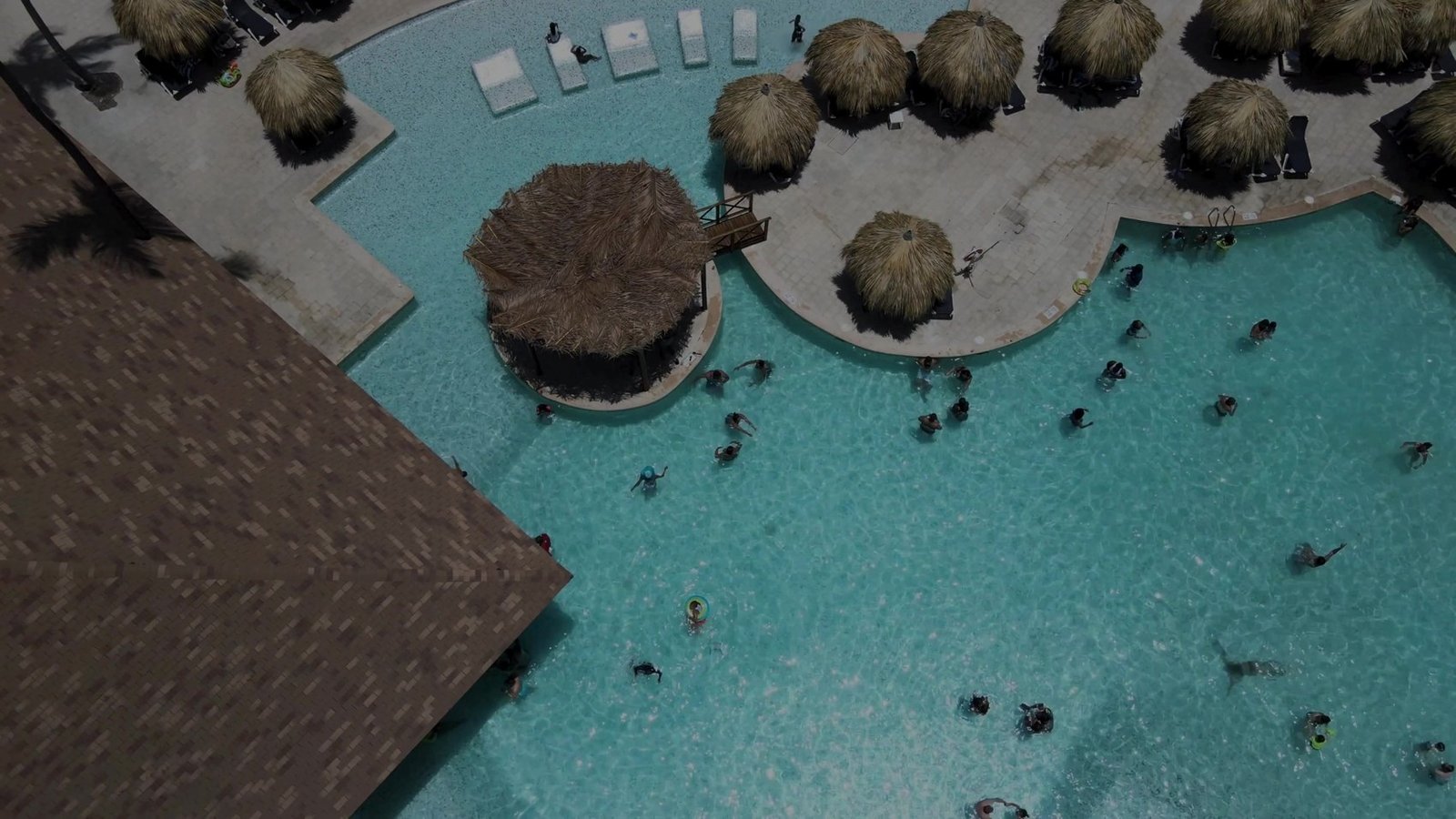 Aerial view of a resort-style pool maintained by RC Professional Cleaning